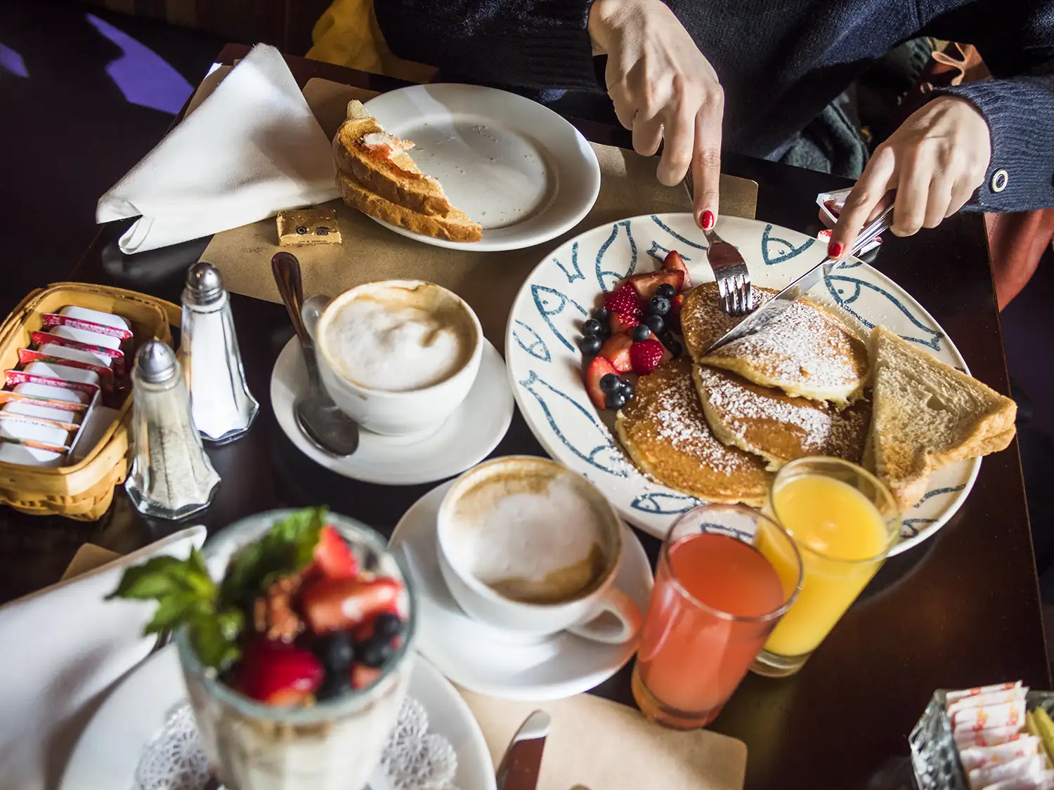 cropped-image-of-woman-having-pancake-with-coffee-2024-10-15-01-41-40-utc